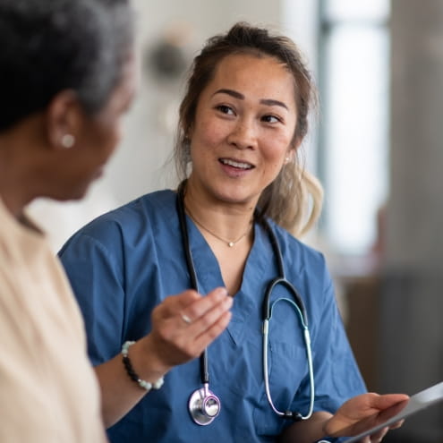 Doctor provides comfort and counseling to patient.