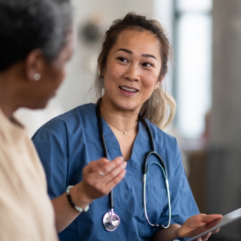 Doctor provides comfort and counseling to patient.